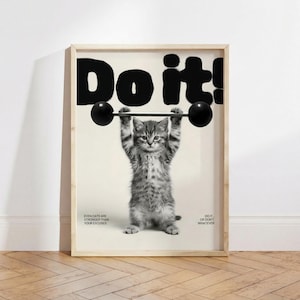 May include: A framed print features a kitten lifting a barbell overhead. The image is in black and white, with the words "Do it!" in bold letters at the top. The text "Even cats are stronger than your excuses" is at the bottom.