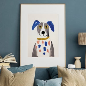May include: A framed illustration of a dog with blue ears, a white and pink checked collar, and yellow eyes. The dog is painted in a simple, childlike style.