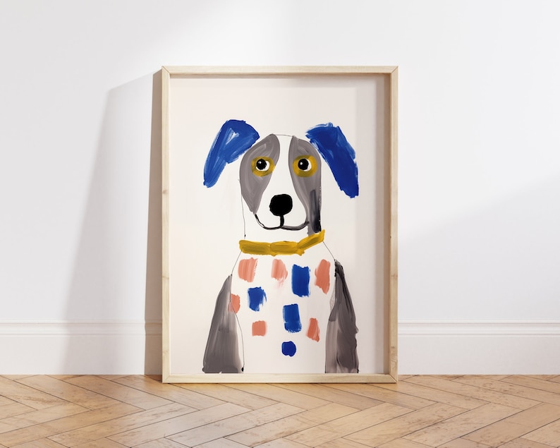 May include: A framed illustration of a dog with blue ears, a yellow collar, and a pink and blue patterned shirt. The dog is painted in a simple, childlike style.
