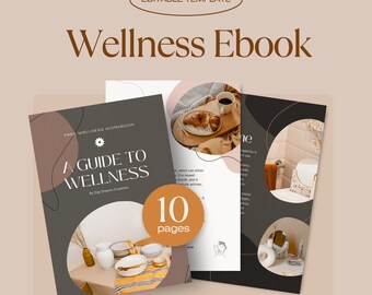 Può includere: Copertina di un ebook sul benessere con una tavola apparecchiata a righe bianche e marroni, una tazza di caffè e un croissant su un piatto di legno, e un'illustrazione in bianco e nero del viso di una donna. Il testo sulla copertina recita "Free Wellness Workbook, A Guide to Wellness, By Dig Dreams Creations, 10 pages".