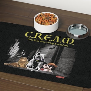 May include: Black cat themed floor mat with the text "C.R.E.A.M. Cats Rule Everything Around Me". The mat features a black and white image of three cats in an urban setting.