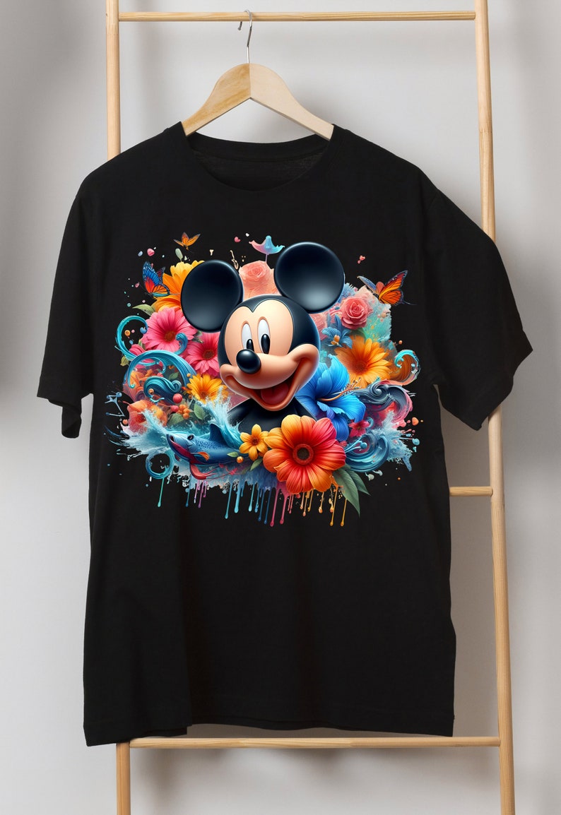 May include: Black t-shirt with a colorful graphic of Mickey Mouse surrounded by flowers and water splatter.