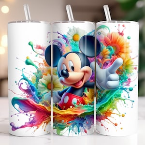 May include: A white tumbler with a colorful paint splatter design featuring Mickey Mouse. The design includes flowers and splashes of color in shades of blue, green, yellow, orange, pink, and purple.