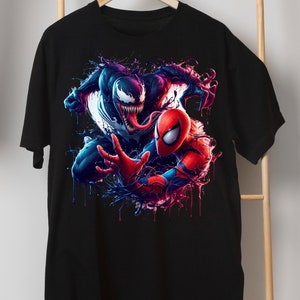 May include: Black t-shirt with a graphic print of Venom and Spider-Man in a battle pose. The graphic is in a vibrant blue, red, and black color scheme.