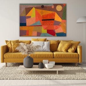 May include: Abstract geometric painting with a red, yellow, and blue color scheme. The painting features a variety of shapes, including squares, rectangles, and triangles. The painting is framed and hanging on a wall.