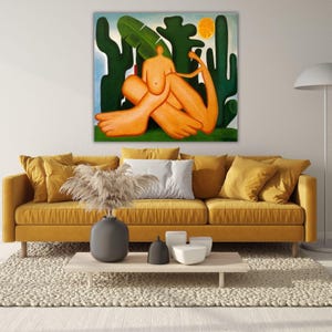 May include: A square canvas wall art print featuring a stylized orange figure sitting amidst dark green cacti and large leaves under a bright yellow sun. The artwork displays bold, rounded shapes and a vibrant color palette, creating a striking visual focal point for interior wall decor.