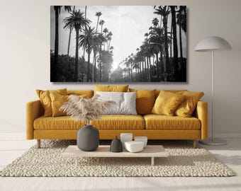 May include: A rectangular wall art print featuring a black and white photograph of a palm tree-lined street. The image displays a perspective view of tall palm trees stretching into the distance with a bright light source at the horizon line.