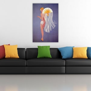 May include: A rectangular wall art print featuring a stylised illustration of a figure in a red geometric dress holding a large white fan with a yellow sun motif. The figure has blonde hair and wears yellow shoes against a solid purple background.