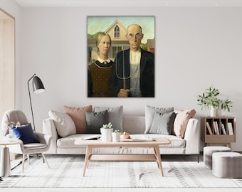 May include: A framed print of Grant Wood's American Gothic painting, featuring a stern-faced individual in a dark jacket holding a pitchfork and another individual in a brown patterned dress with a white collar, standing before a white house.