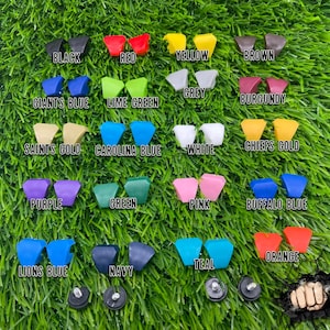May include: A collection of 18 plastic triangle-shaped pieces in various colors, including black, red, yellow, brown, grey, blue, green, white, gold, purple, pink, orange, and teal. The pieces are arranged in a grid pattern on a green grassy surface.