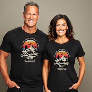 May include: Black t-shirts with a mountain graphic and the text "The Smoky Mountains Are Calling Adventure Awaits Johnson Family Vacation 2024." The graphic features a mountain range, trees, birds, and a sunset.