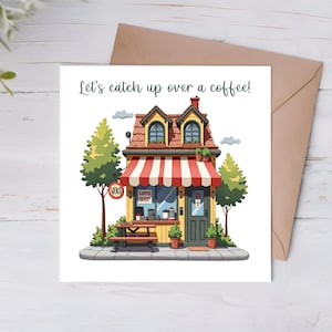 K&ouml;nnte beinhalten: Eine Gru&szlig;karte mit einer Cartoon-Illustration eines Caf&eacute;s mit einem rot-wei&szlig; gestreiften Vordach. Der Text auf der Karte lautet "Let's catch up over a coffee!"