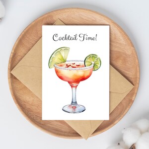May include: A greeting card with the text "Cocktail Time!" and a watercolor illustration of a margarita with a lime wedge.