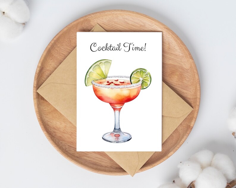 May include: A greeting card with the text "Cocktail Time!" and a watercolor illustration of a margarita with a lime wedge.