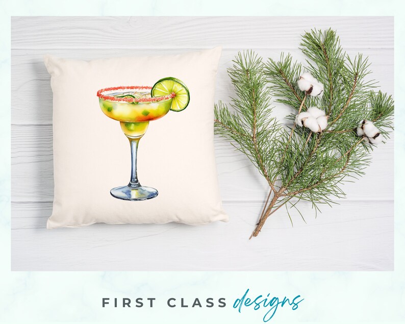May include: A white pillow with a watercolor illustration of a margarita cocktail with a lime wedge. The margarita glass has a pink sugar rim and is filled with a yellow liquid.