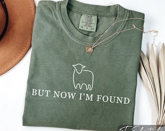 Camiseta cristiana Comfort Colors: Pero ahora me han encontrado, versículo bíblico