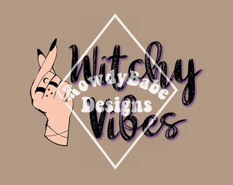 May include: A black and white graphic design with the text "Witchy Vibes" in a diamond shape. The text "Rowdy Babe Designs" is in smaller font and is partially obscured by the diamond shape. A pink hand with a crescent moon and stars tattoo is shown to the left of the text.