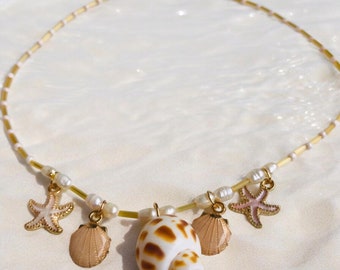 Shell necklace with genuine shell pendant and enamel charms in beige and pastel colors, natural freshwater pearls, beach jewelry