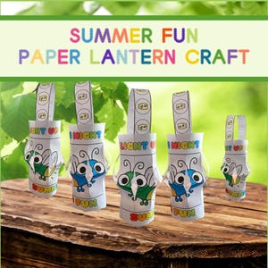 May include: Paper lantern craft with a summer theme. The lanterns are white with colourful insect designs and the words "LIGHT UP NIGHT" and "SUMMER FUN". The lanterns are on a wooden surface with a green background.