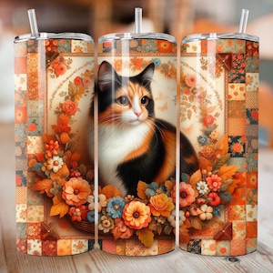 May include: A stainless steel tumbler with a colorful design featuring a calico cat with orange, black, and white fur. The design also includes a floral pattern with fall colors like orange, red, and yellow. The tumbler is perfect for holding hot or cold beverages.
