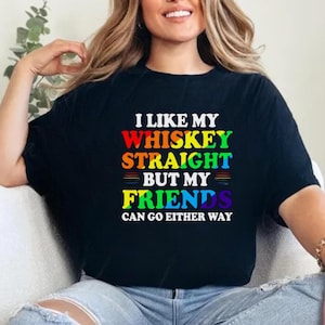 May include: A black t-shirt with a rainbow design and the text "I like my whiskey straight but my friends can go either way".