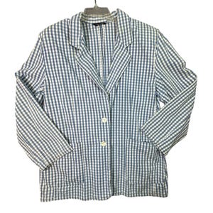 May include: A blue and white gingham blazer with two front pockets and two white buttons. The blazer is hanging on a hanger against a white background. The jacket has a classic collar and long sleeves.