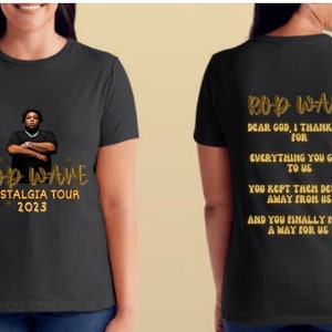 May include: Black t-shirt with a gold graphic of rapper Rod Wave and the text "Rod Wave Nostalgia Tour 2023". The back of the shirt has gold text that reads "Dear God, I thank you for everything you gave to us. You kept then devils away from us. And you finally made a way for us."