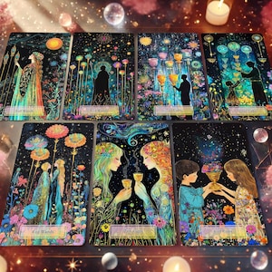 May include: A set of 7 tarot cards with gold foil accents and colorful illustrations. The cards feature a variety of scenes, including a woman holding a staff, two people sharing a cup, and a group of people standing in a field. The cards are part of a larger tarot deck.