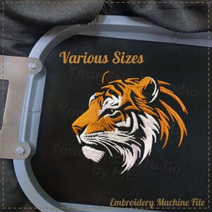 May include: Embroidery machine file of a tiger's head in profile. The tiger is orange and white with black stripes. The text "Various Sizes" is above the tiger's head.