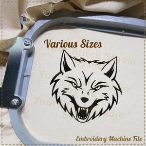 May include: Black and white embroidery design of a wolf's head with an open mouth and sharp teeth. The design is on a white fabric with the text "Various Sizes" and "Embroidery Machine File" below it.
