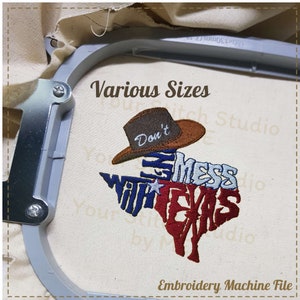 May include: Embroidered design of the state of Texas with the words "Don't Mess With Texas" and a cowboy hat. The design is in red, white, and blue.