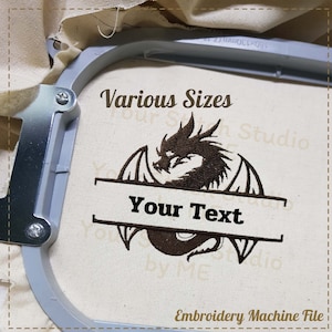 May include: Embroidery machine file featuring a brown dragon with wings curled around a banner that says "Your Text". The design is on a white fabric in a hoop. The text "Various Sizes" is above the design.