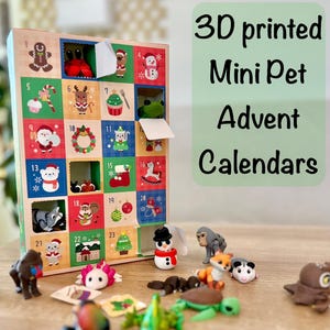 May include: A wooden Advent calendar with 24 numbered doors, each revealing a miniature 3D-printed pet figurine. The calendar features festive illustrations. The text "3D printed Mini Pet Advent Calendars" is also visible.
