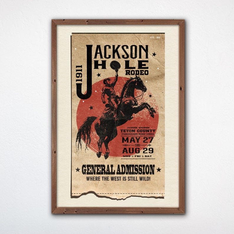 May include: Vintage poster advertising the Jackson Hole Rodeo, featuring a cowboy riding a bucking bronco against a red sun. The poster is distressed and has a faded look. The text reads "Jackson Hole Rodeo" and "General Admission Where the West is Still Wild!" with dates of May 27 to August 29.