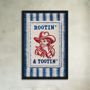 May include: Framed artwork featuring a cowboy illustration with the text "ROOTIN' & TOOTIN'". The image has a white background with a blue and white striped pattern. The cowboy is wearing a red hat and covering their mouth.