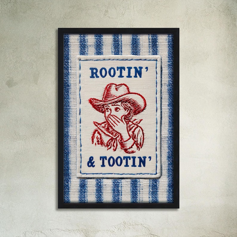 May include: Framed artwork featuring a cowboy illustration with the text "ROOTIN' & TOOTIN'". The image has a white background with a blue and white striped pattern. The cowboy is wearing a red hat and covering their mouth.