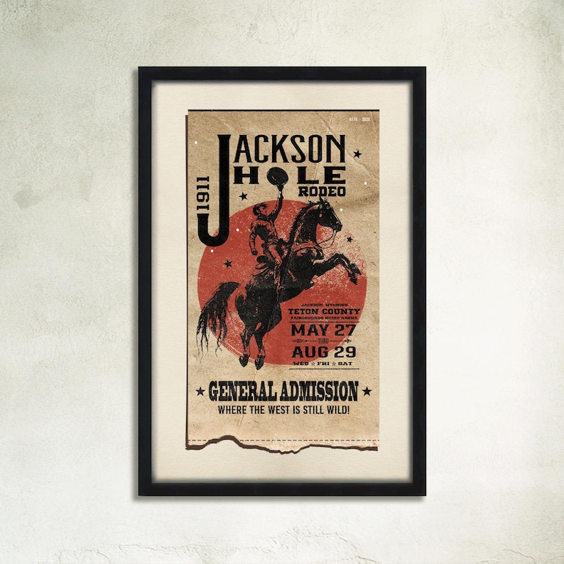 May include: A vintage poster advertising the Jackson Hole Rodeo in Teton County, Wyoming. The poster features a red circle with a white star, a cowboy riding a bucking horse, and the dates May 27 and August 29, 1911.