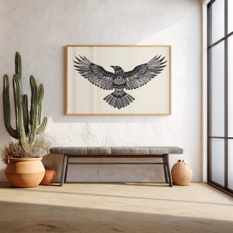 Tribal raven wall art print in black and white featuring a detailed geometric bird design with outstretched wings, framed against an off-white background.