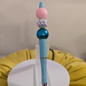 Light blue bead pen with teal and pink fancy beads