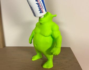 3d Gedruckter Zahnpastaspender mit einem großen grünen Kerl