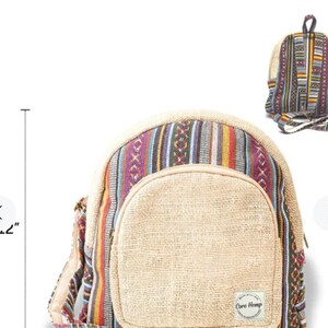 May include: A small, multi-colored hemp backpack with a large front pocket. The backpack has a woven design with stripes and geometric patterns in shades of purple, red, yellow, blue, and black. The front pocket is made of natural hemp fabric and has a "Core Hemp" logo.