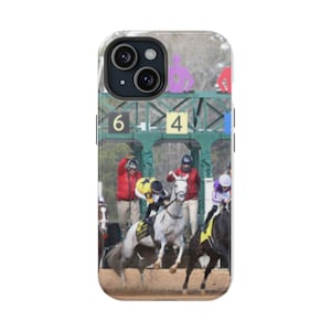 May include: A phone case with a photo of horses racing at a track. The horses are white and brown, and the riders are wearing colorful jockey silks. The numbers "6" and "4" are visible on the track.
