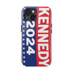 May include: A blue and red phone case with the text "KENNEDY 2024" printed on it. The case has a white star pattern on the blue side.