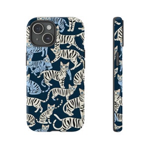 May include: A blue and white phone case with a pattern of white and black striped cats with blue eyes. The case is designed for an iPhone.