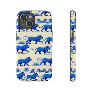 May include: A white phone case with a blue lion pattern. The case has a black camera cutout and a black border.