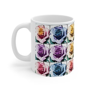 May include: White ceramic mug with a colorful rose pattern. The roses are in shades of pink, purple, blue, and yellow. The pattern is repeated nine times on the mug.
