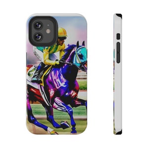 May include: A phone case featuring a vibrant, artistic depiction of a horse race. The design showcases a jockey in yellow and green attire riding a horse with a blue and purple color scheme. The case has a white border and a black camera cutout.