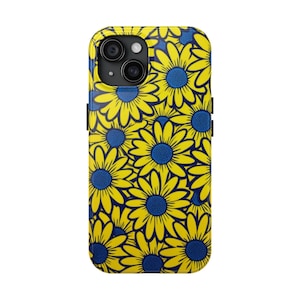 May include: A yellow phone case with a pattern of blue and yellow daisies.