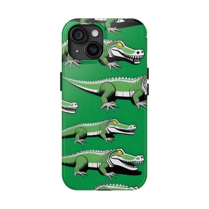 May include: A green phone case featuring a repeating pattern of cartoon alligators. The alligators are green with white bellies, yellow eyes, and white teeth. The background is a solid green color. The phone case has a black camera and button details.