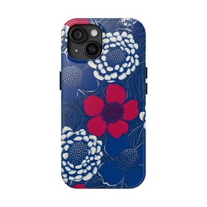 May include: A blue phone case with a white and red floral pattern. The case has a cutout for the camera lens.